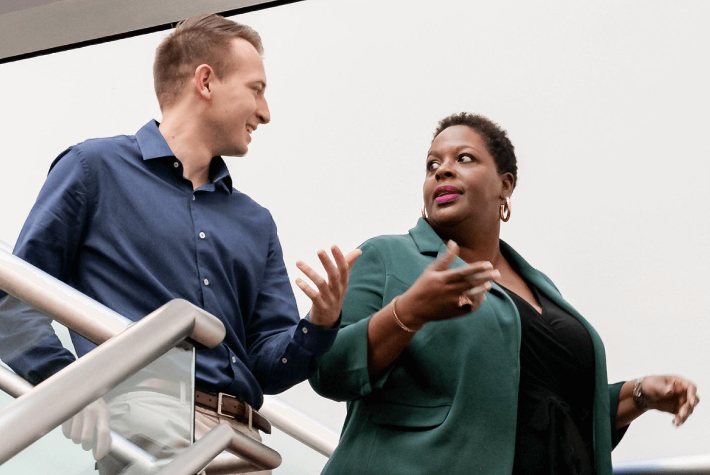 Man and woman talking in stairwell