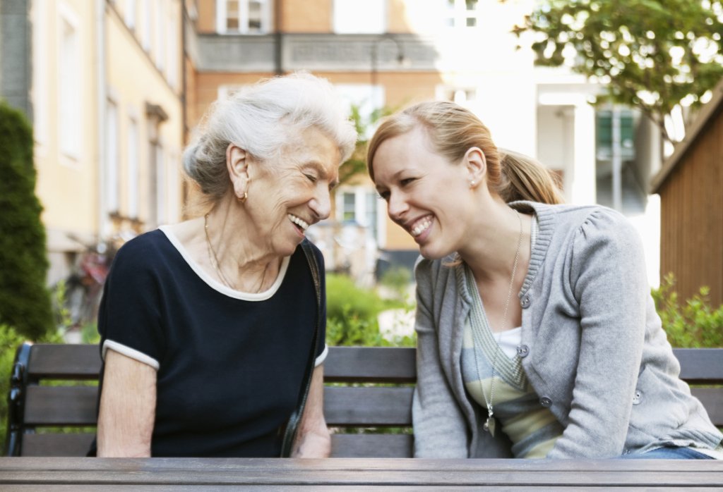 Two women sitting outside