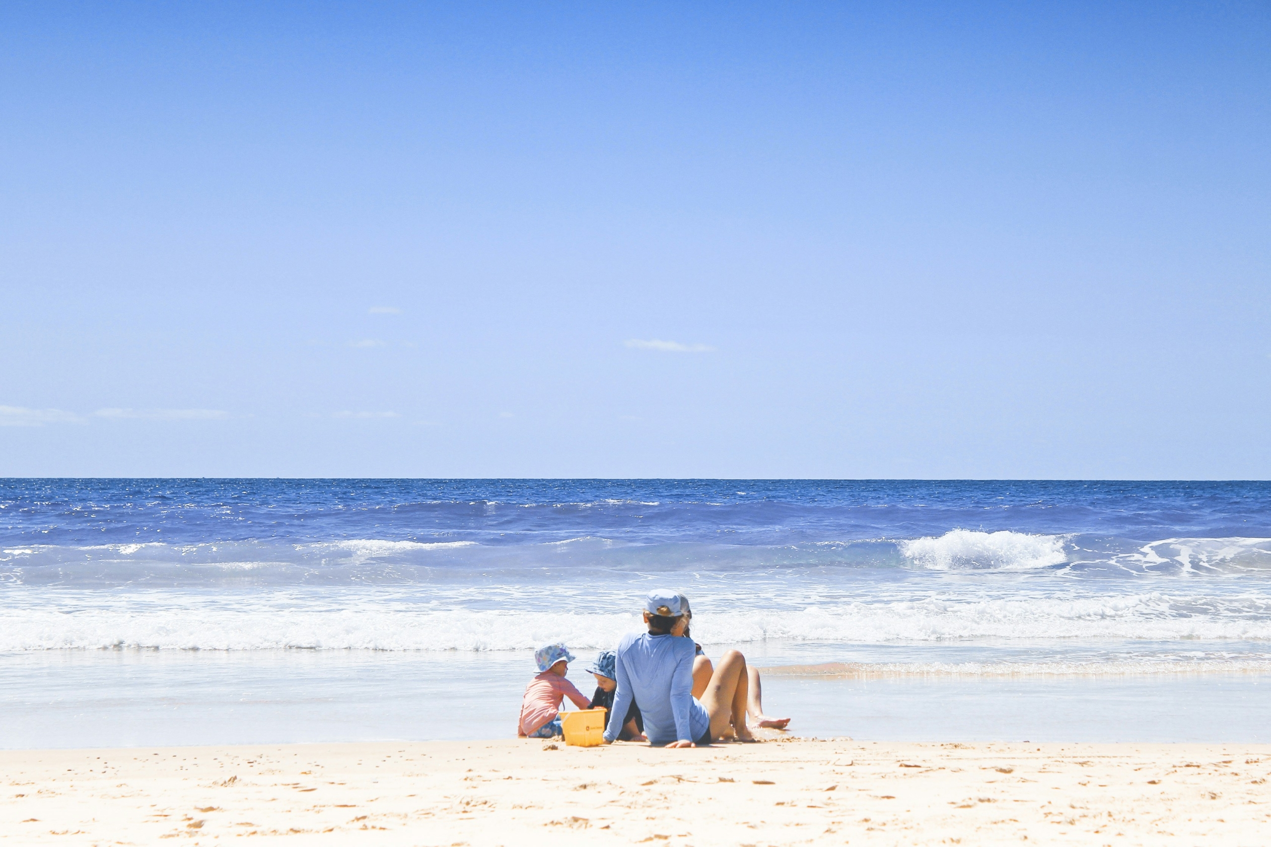 Family enjoying a beach during summer vacation.